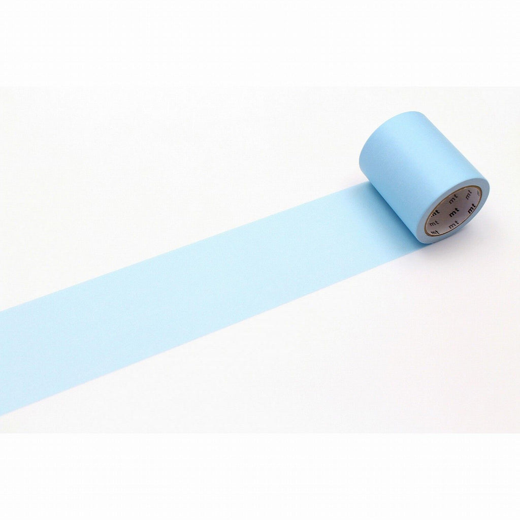 A roll of light blue tape is lying on a white surface, with a single blue line extending from the tape.
