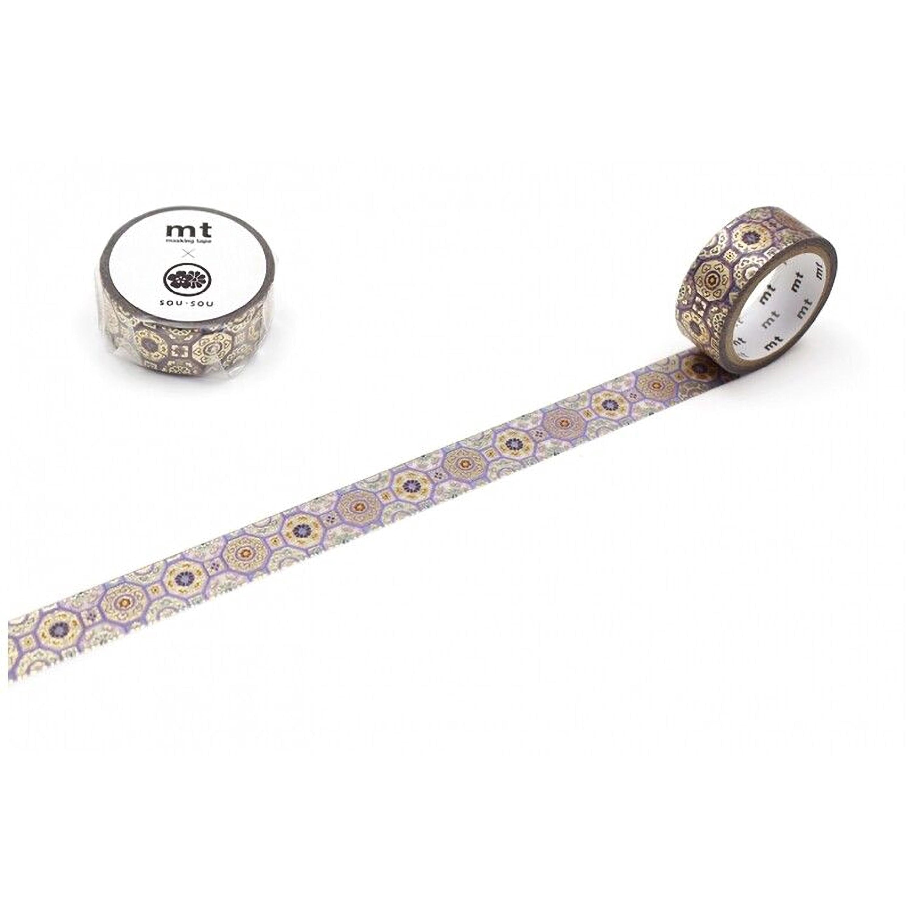 a roll of metallic silver and gold patterned tape with a repeating design, lying on a white surface.
