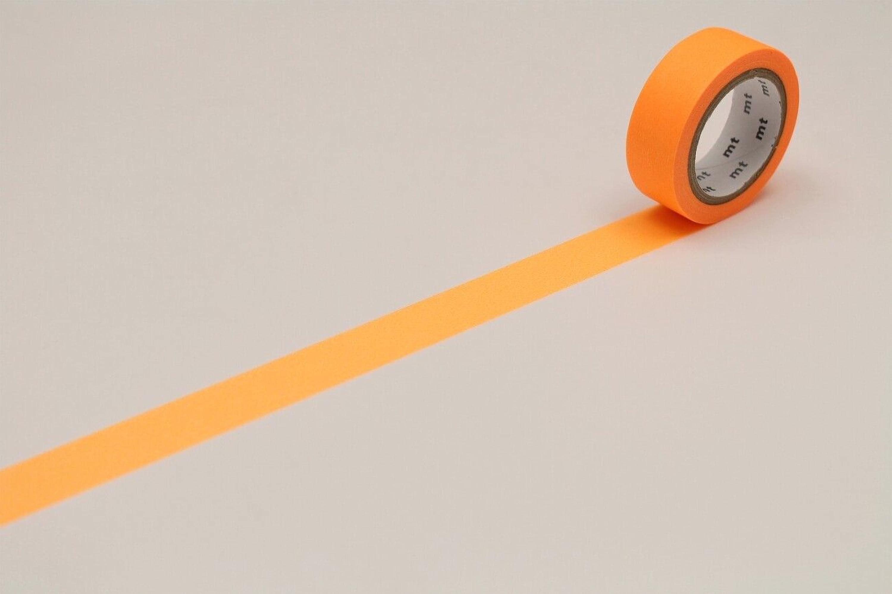 An orange roll of tape is lying on a white surface, with a single orange line extending from the tape.