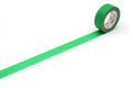 A roll of green tape with a white label is placed on a white surface, with the tape extending across the image.