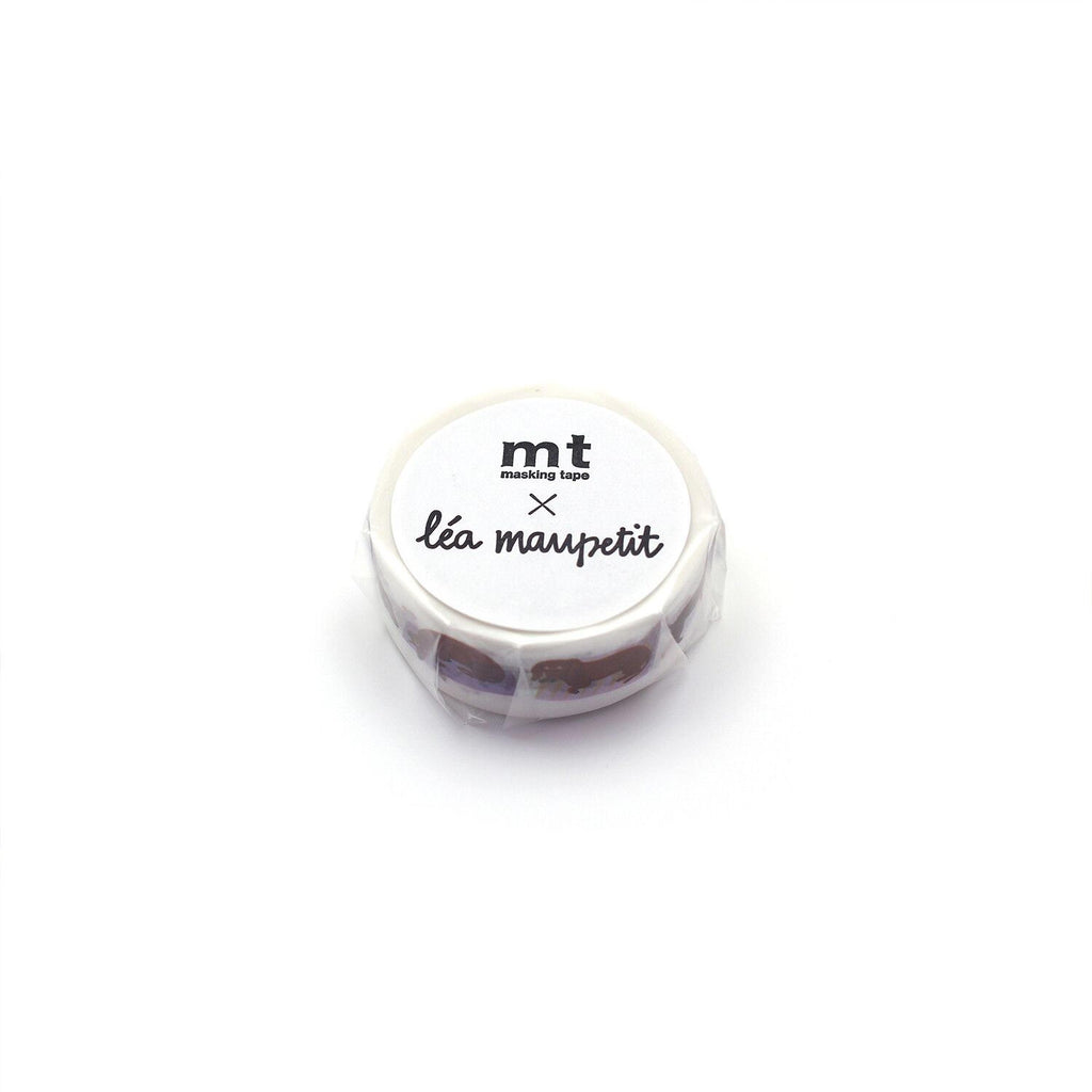 A round object with a label that reads "lea machepit" and "mt masking tape" printed on it.