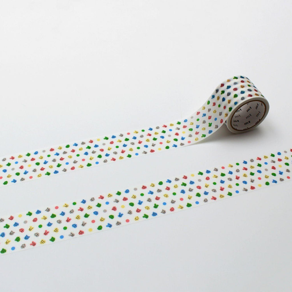 A roll of colorful patterned tape with a repeating design of small circles in various colors, including red, green, yellow, blue, and pink, laid out on a white background.