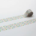 A roll of colorful patterned tape with a repeating design of small circles in various colors, including red, green, yellow, blue, and pink, laid out on a white background.