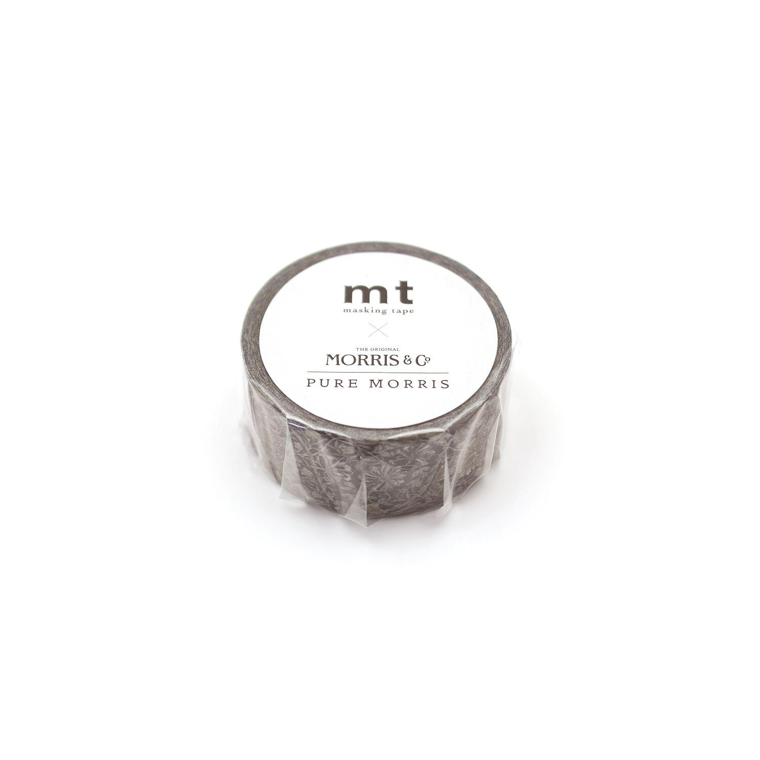A cylindrical object wrapped in clear plastic tape, with a label that reads "mt masking tape" and "Pure Morris".