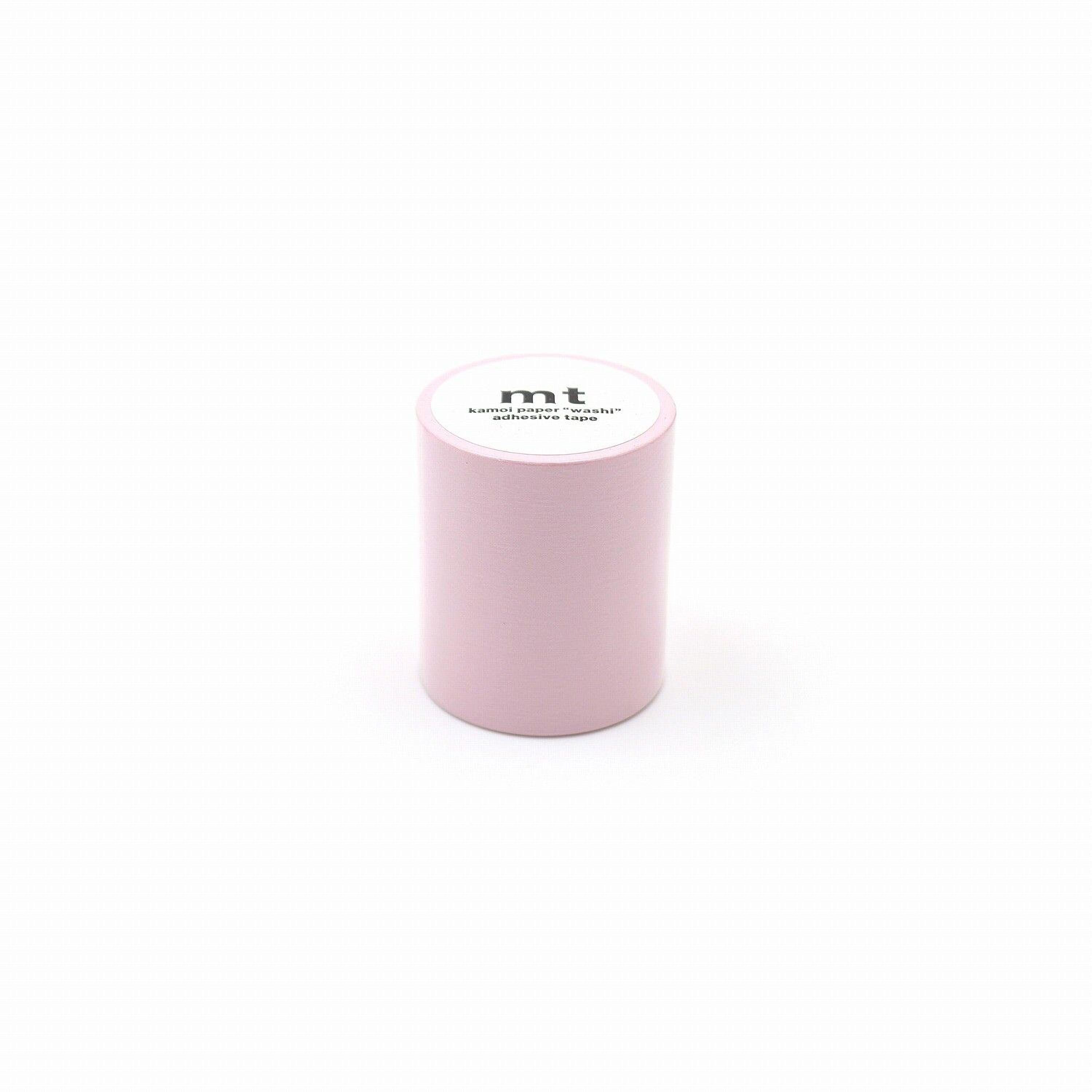 A small, pink cylindrical object with a white label on it, placed against a white background.