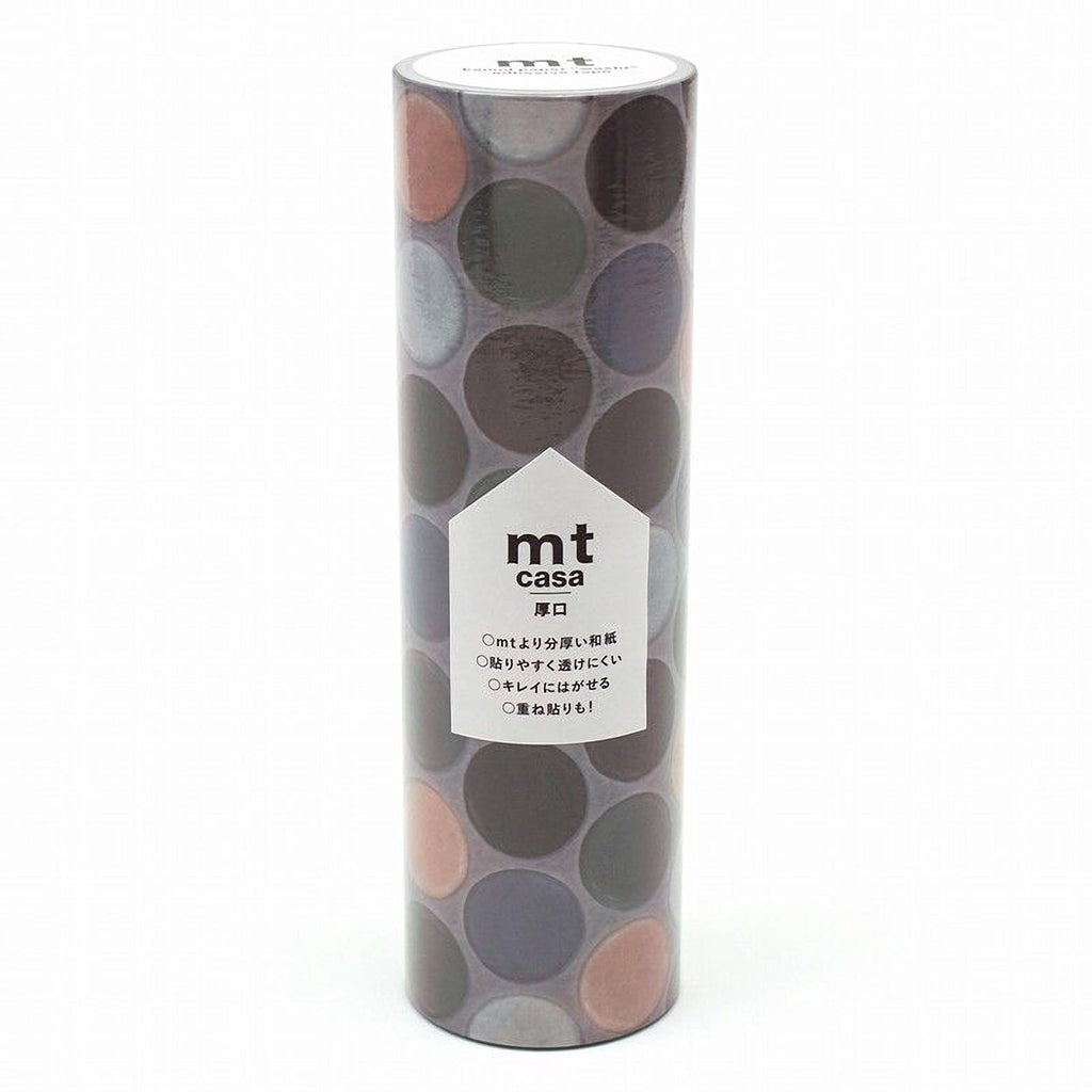 a cylindrical container with a pattern of circles on it, and there is a label with text on it.