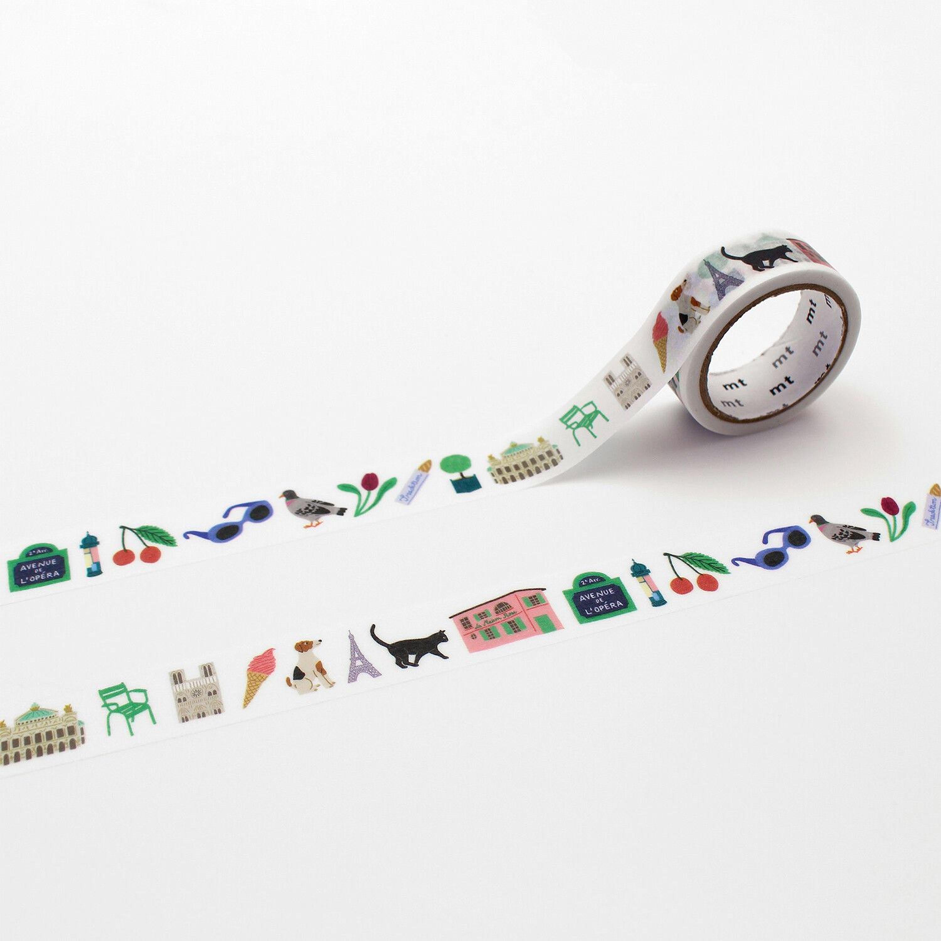A roll of colorful tape with various illustrations of buildings, animals, and objects printed on it, lying on a white background.