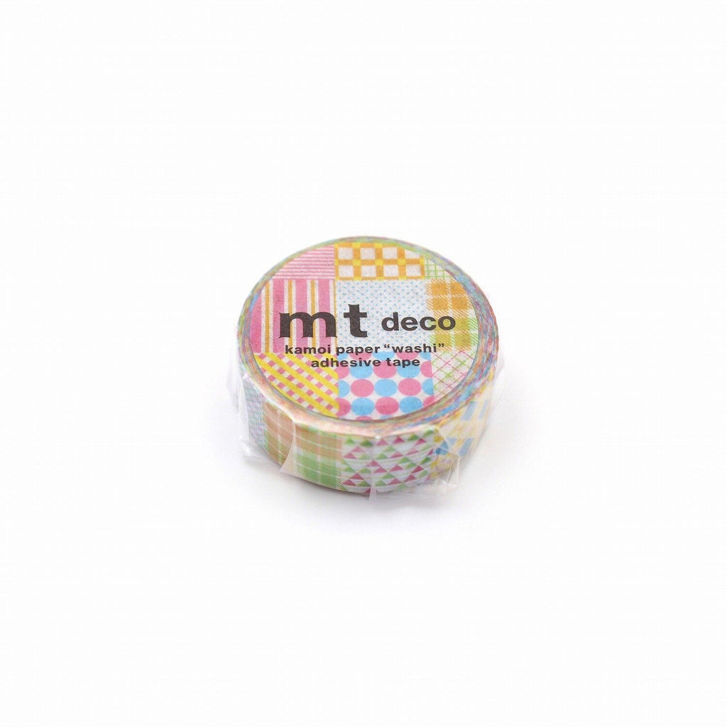 A round, colorful, and patterned tape roll with the text "mt deco" printed on it.