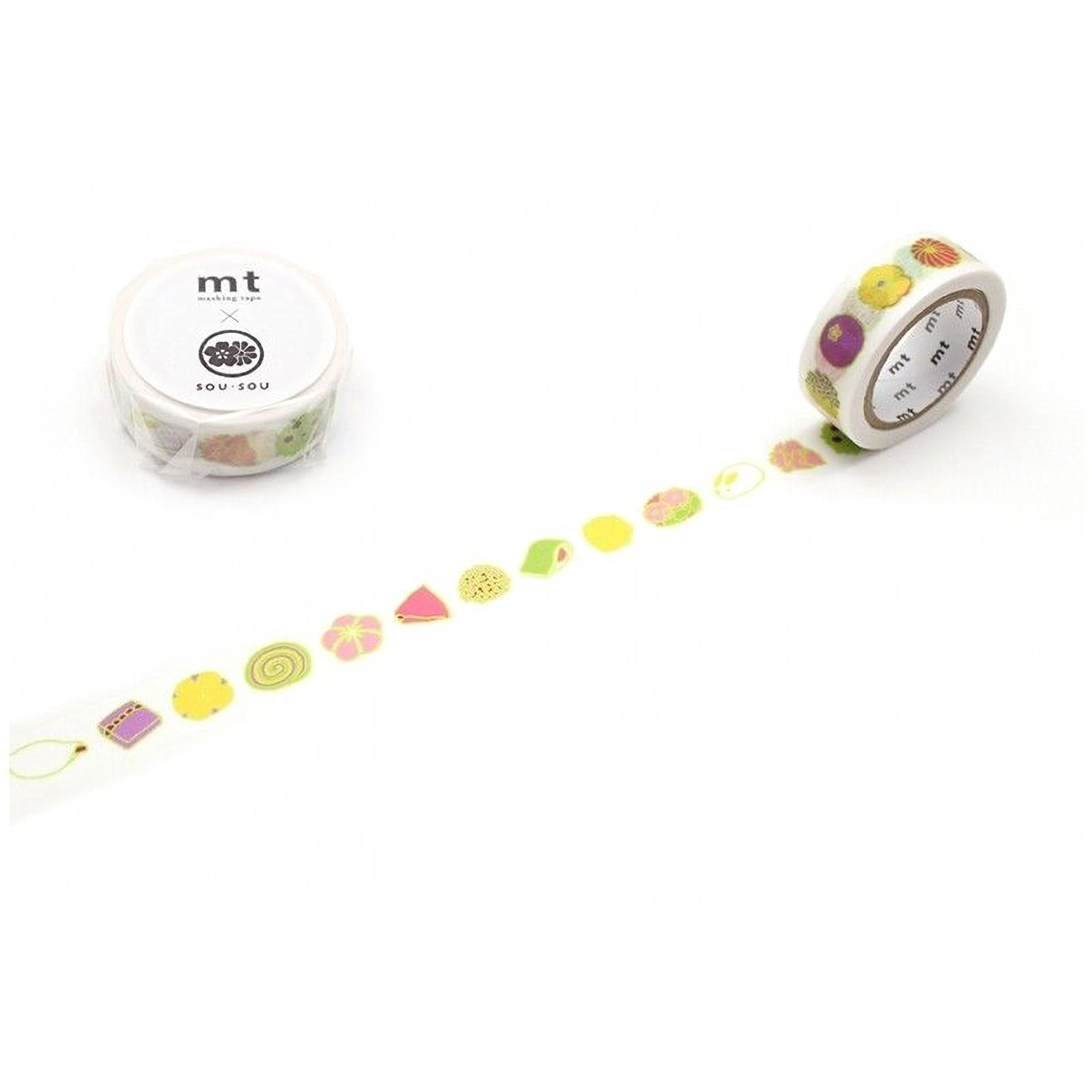 a roll of colorful washi tape with various fruit and vegetable designs on it, along with a small container of the same type of tape.