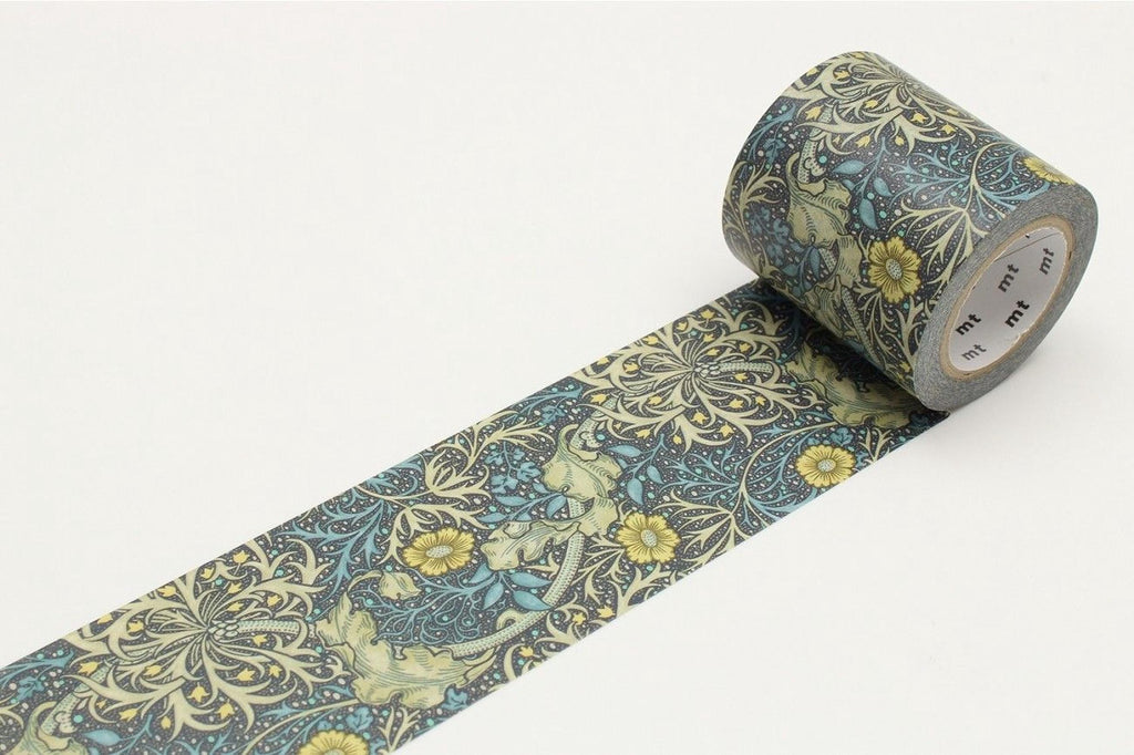 A roll of patterned tape with a floral design in shades of blue and yellow.