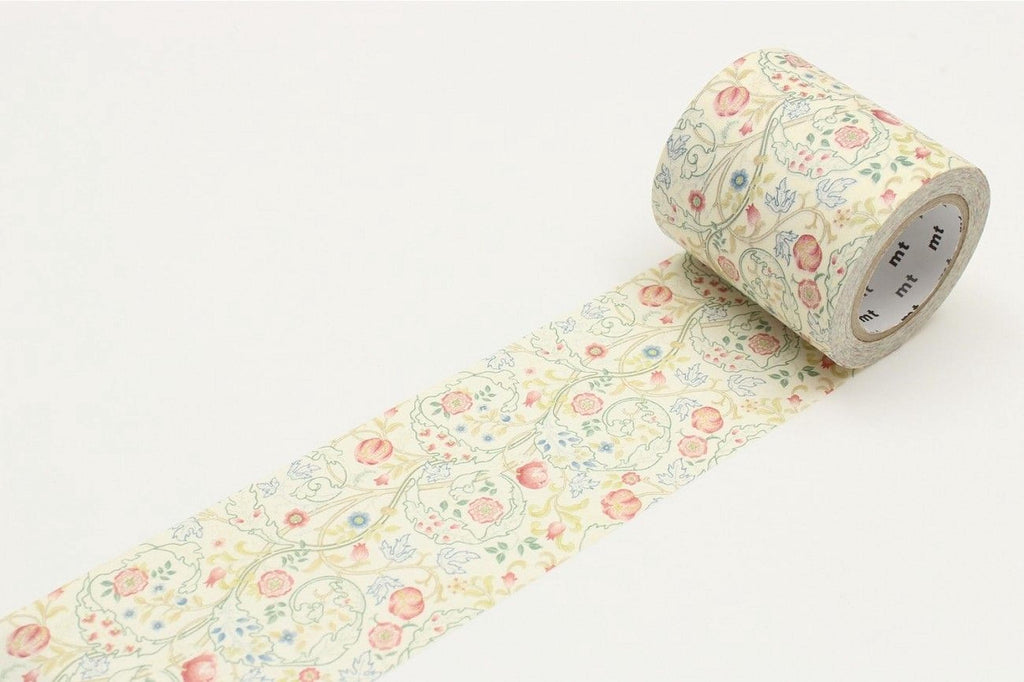 A roll of floral patterned tape is lying on a white surface.