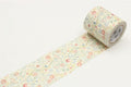 A roll of floral patterned tape is lying on a white surface.
