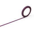 A roll of purple tape is lying on its side on a white background.