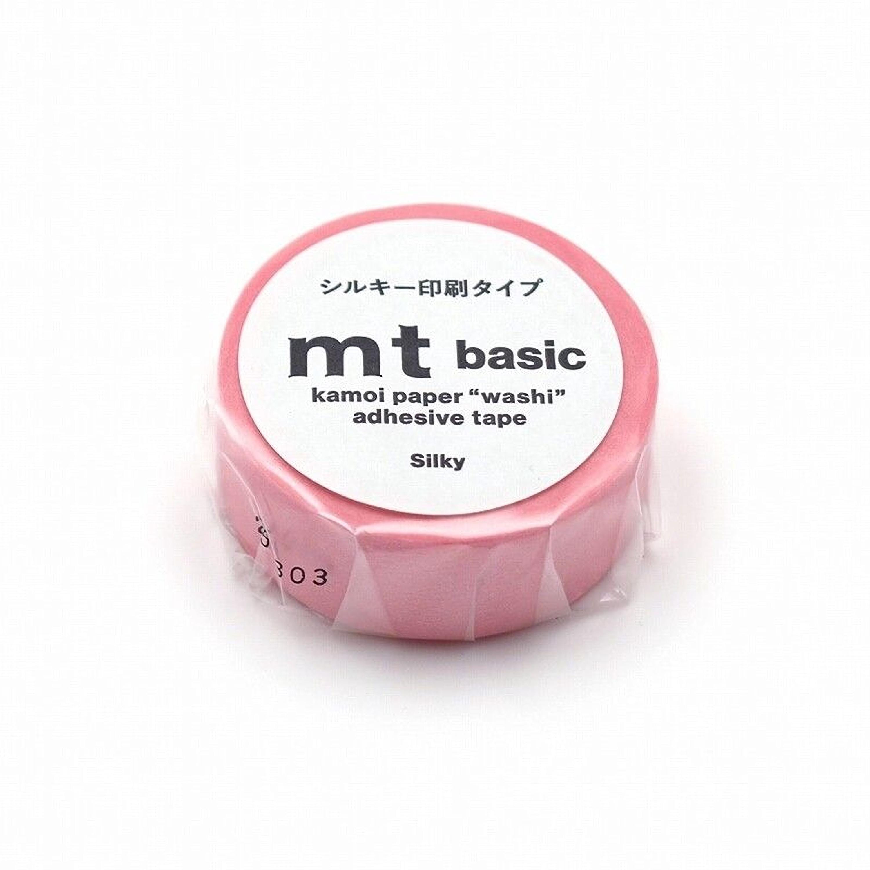 A pink roll of kamol paper "washi" adhesive tape.