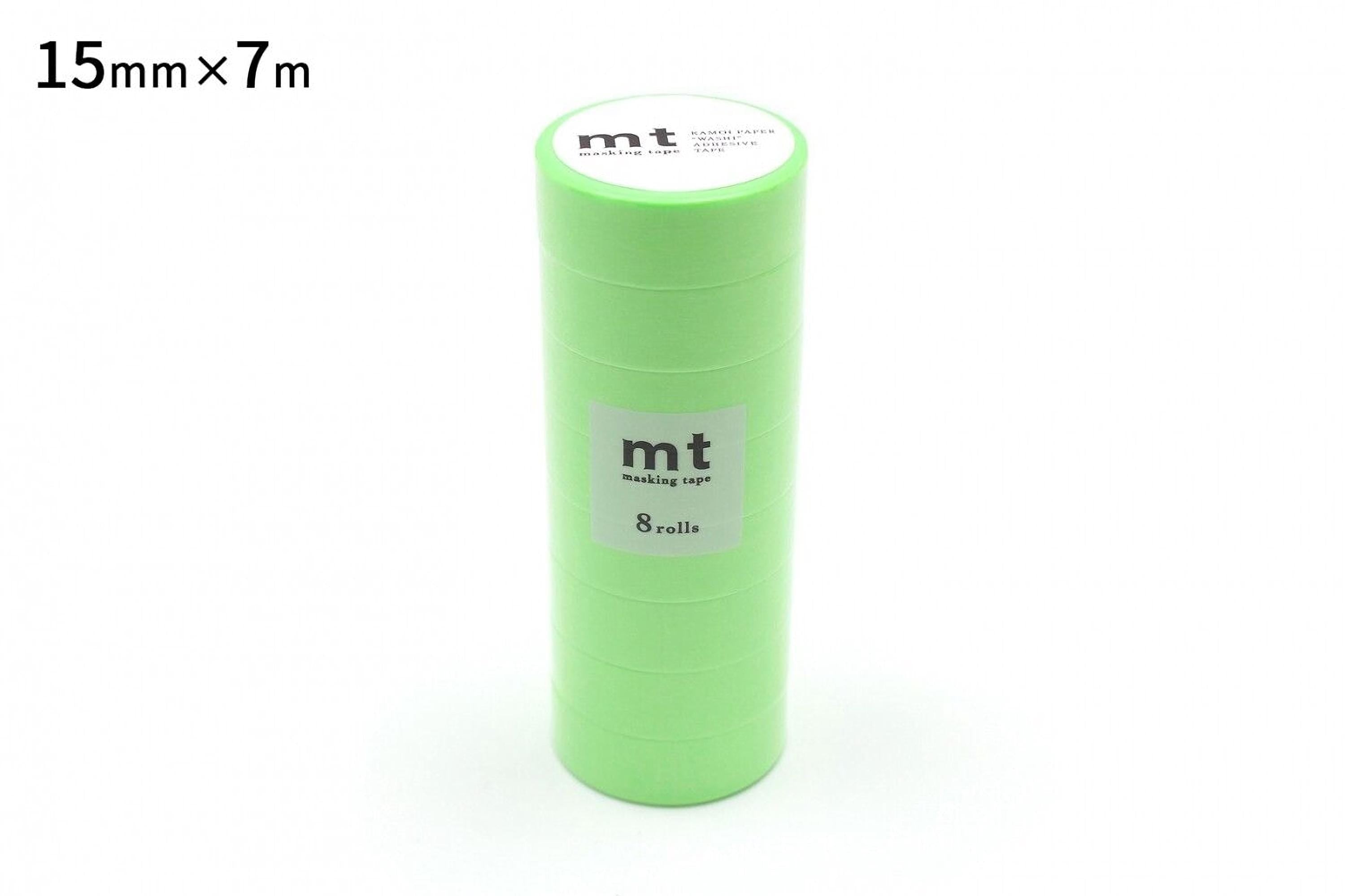 A stack of green cylindrical objects, likely some kind of packaging or container, with a label on the top.