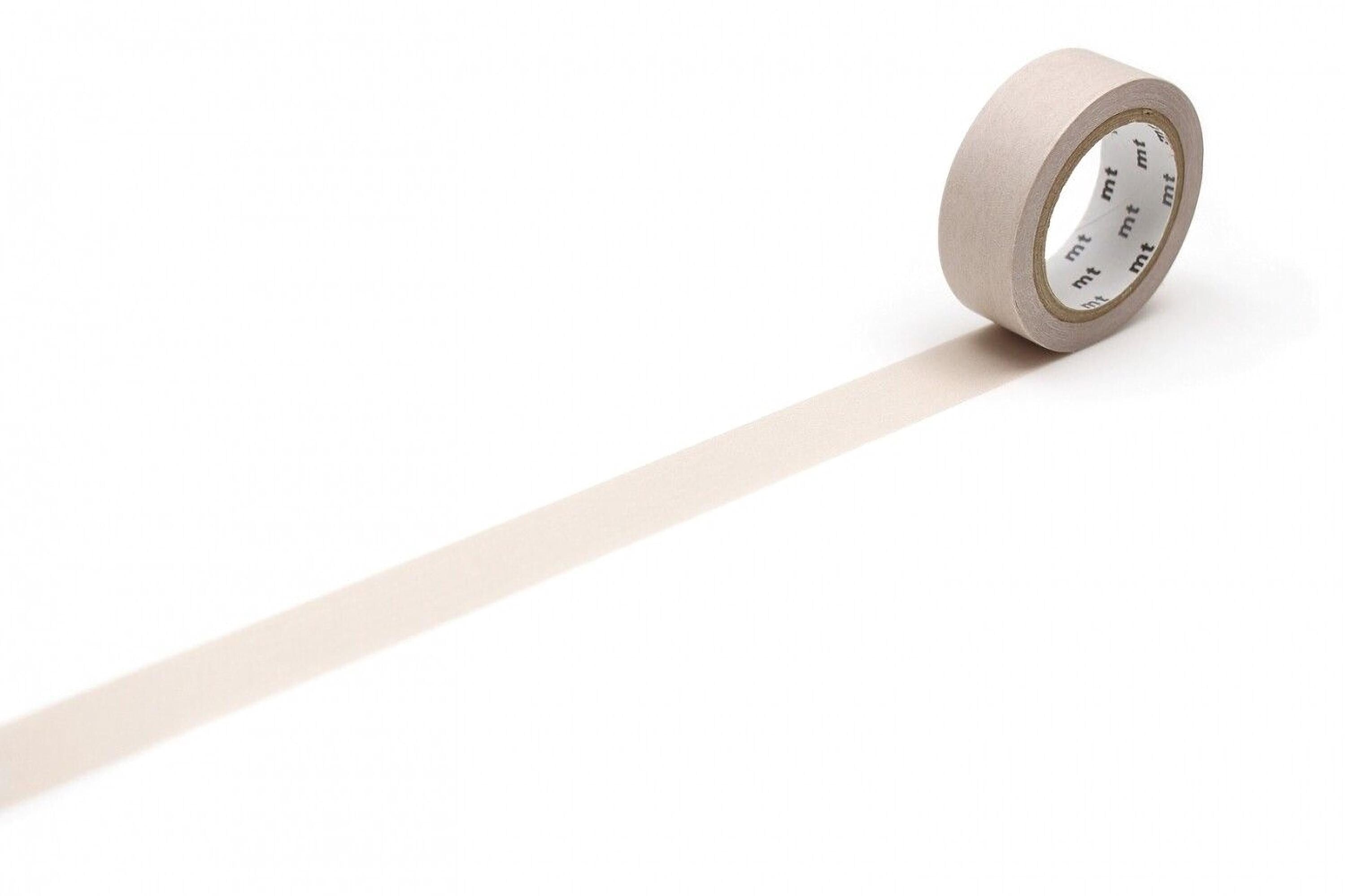 A roll of beige tape with a white label is placed on a white surface, with a long, straight line extending from the tape.