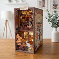 A miniature Peanuts-themed dollhouse with a cozy interior, featuring a clock, books, and other Peanuts characters.