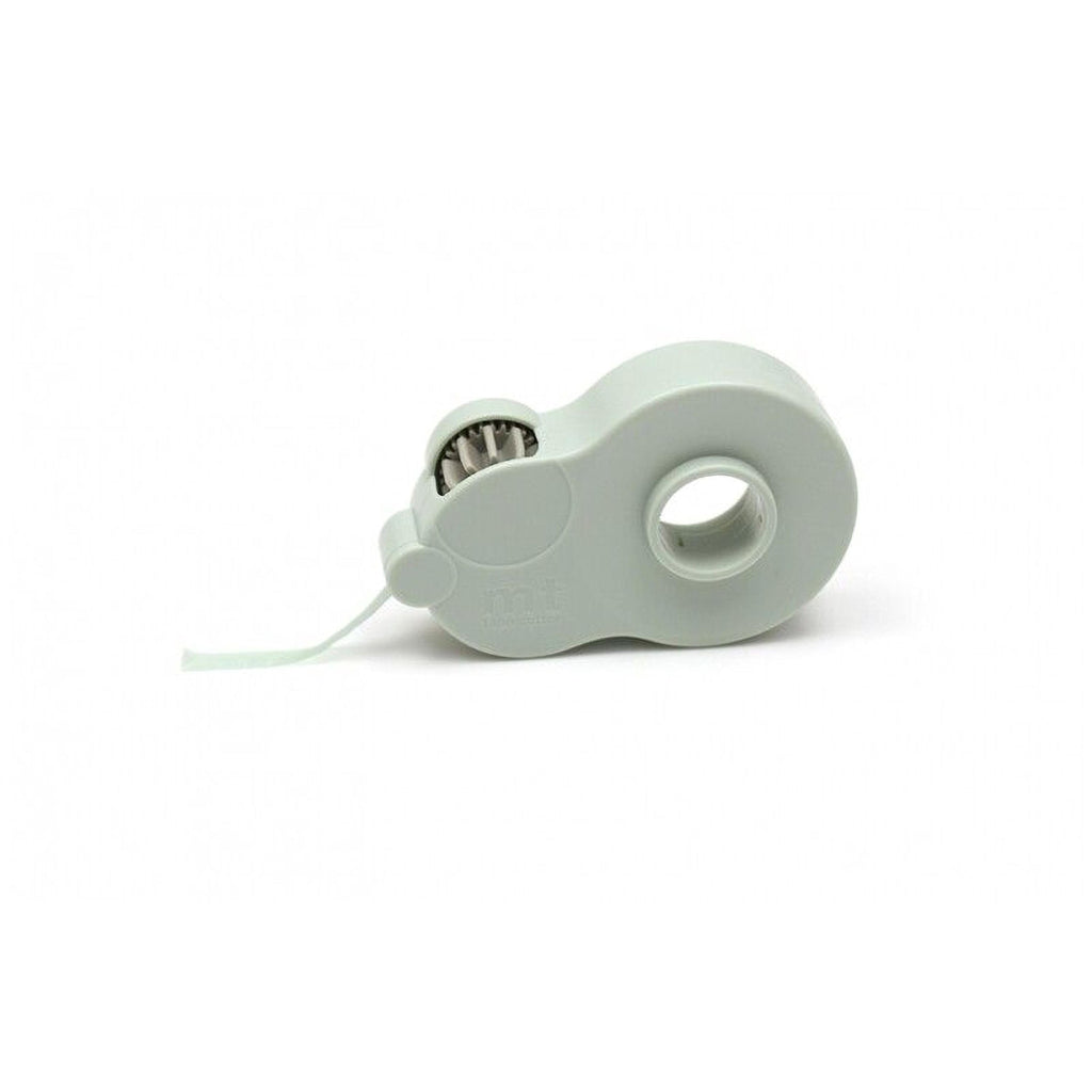 A white, cylindrical object with a hole in the center, resembling a small container or dispenser.