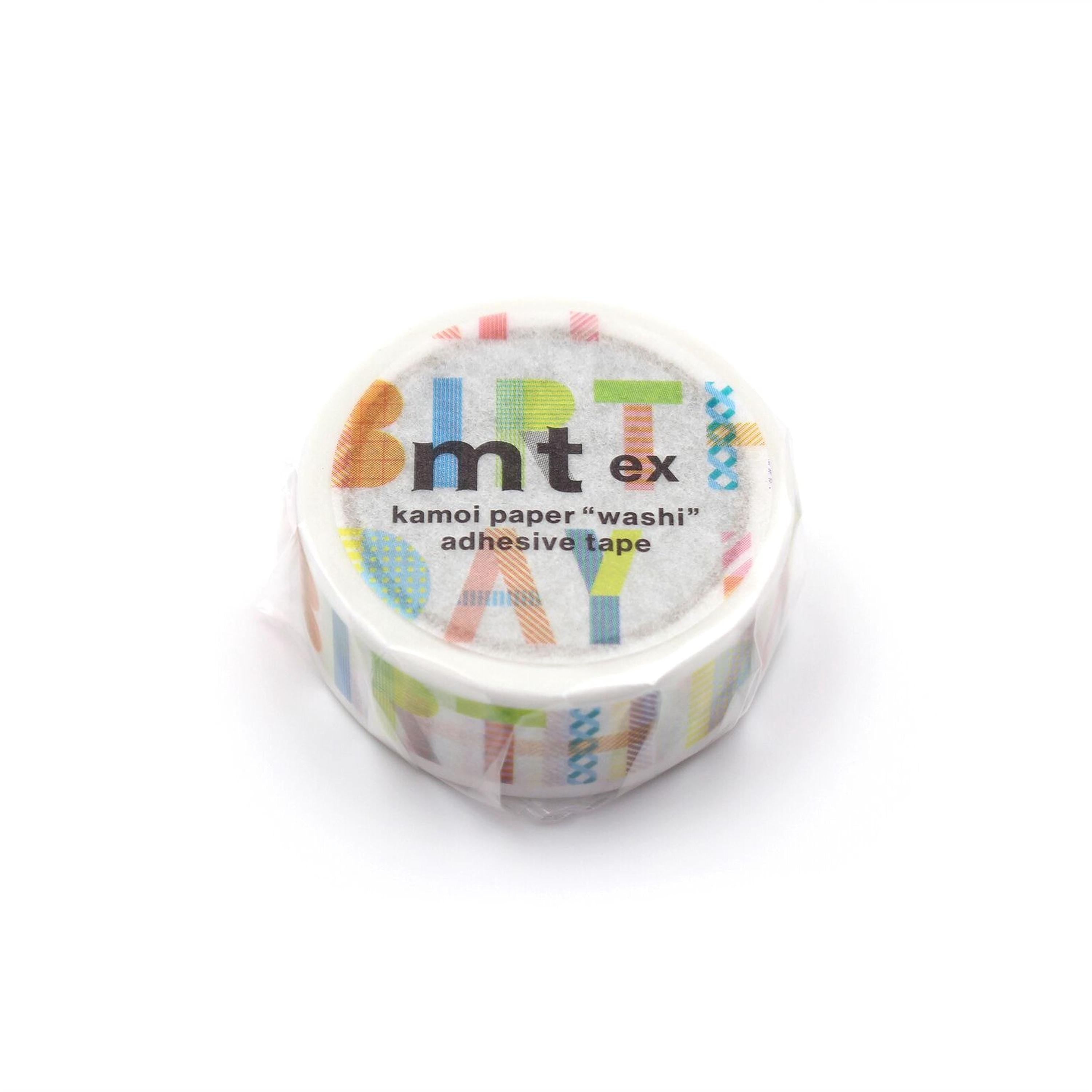 A roll of kamoi paper "washi" adhesive tape with a colorful, abstract design on the label.