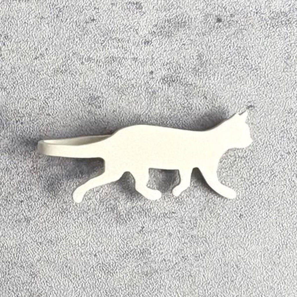 A white cat silhouette is shown against a textured gray background.