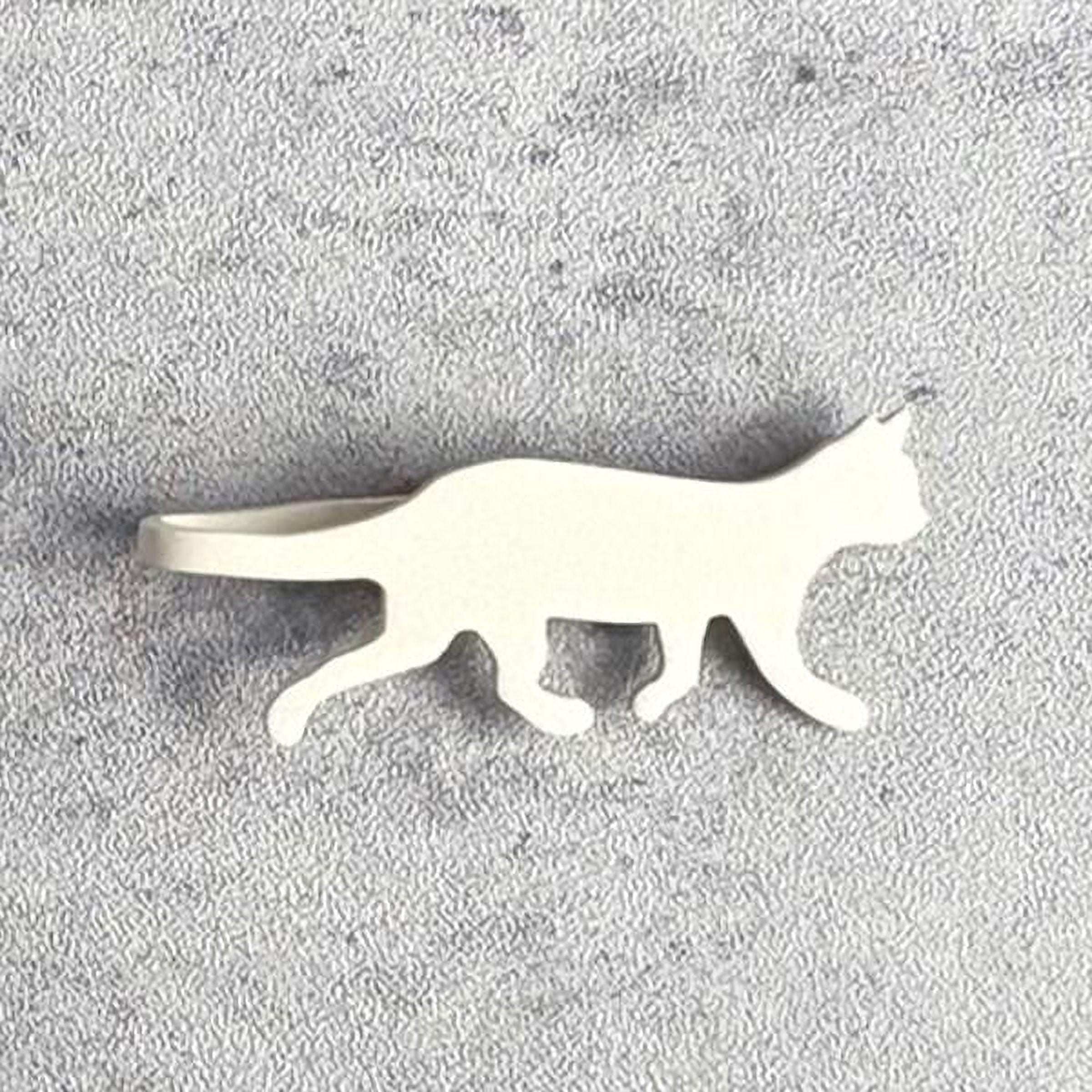 A white cat silhouette is shown against a textured gray background.