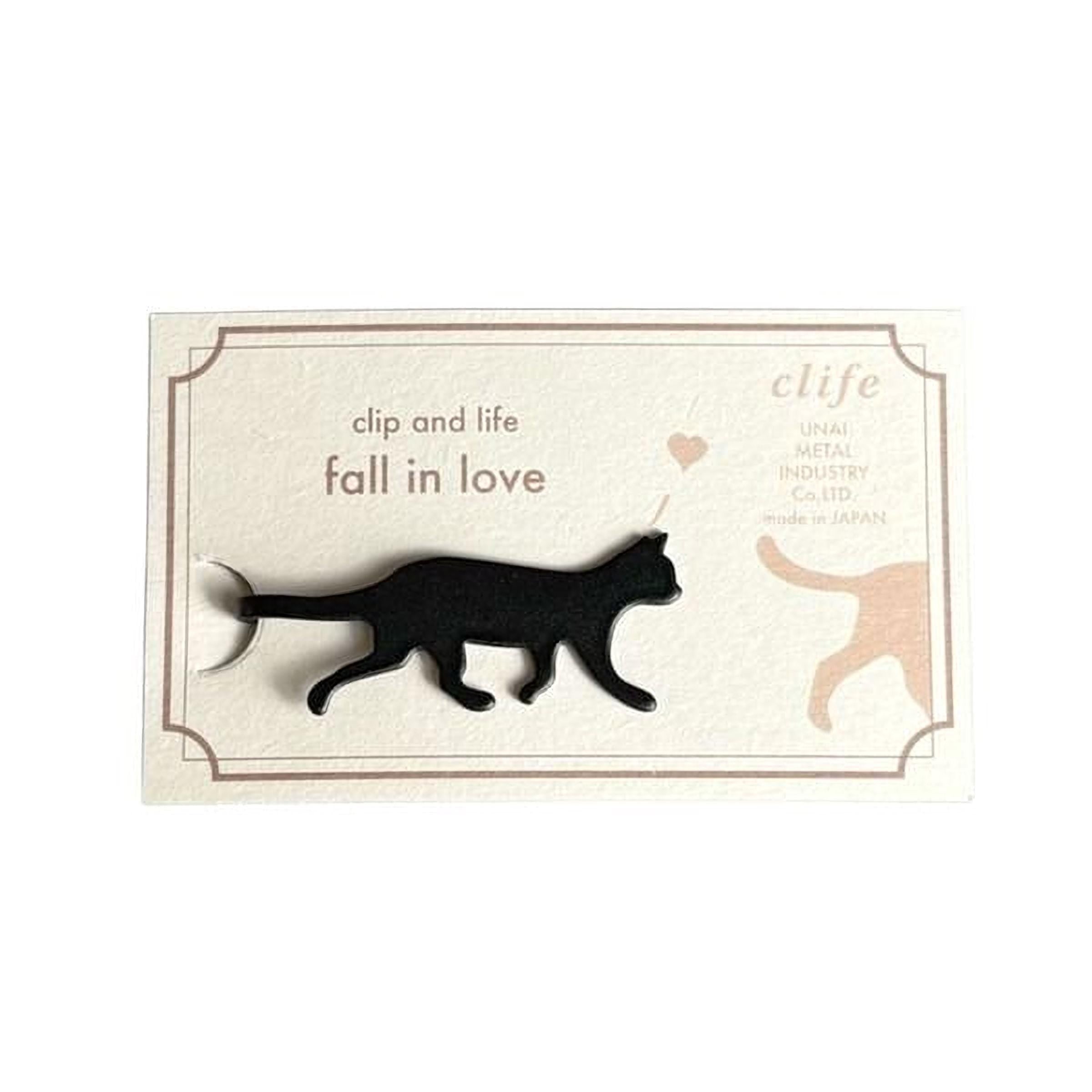 a black cat walking on a white background.