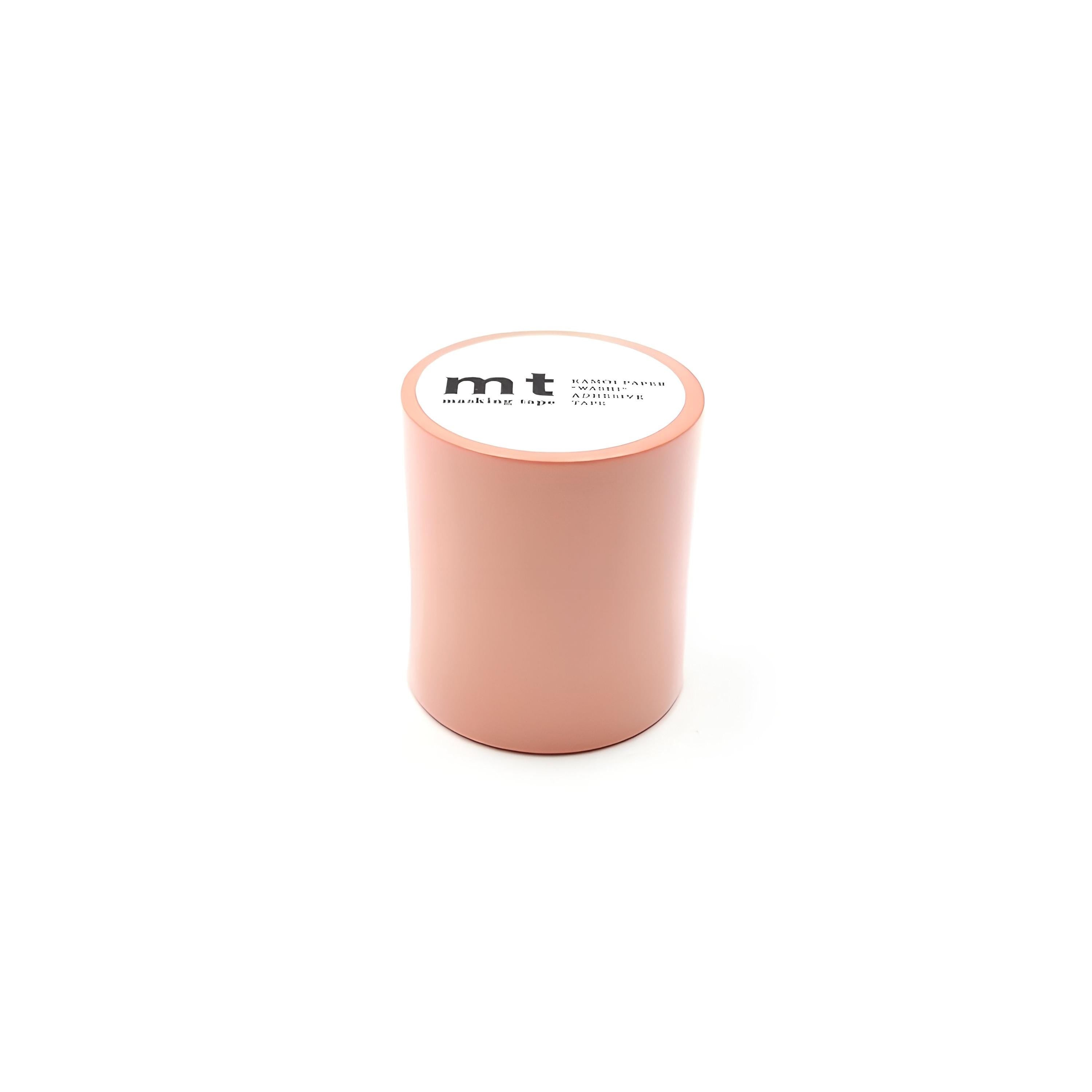 A cylindrical object with a white label on it, which appears to be a cylindrical container or tube.