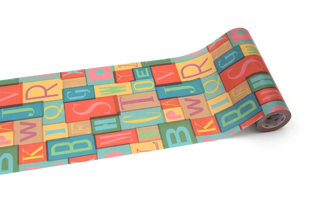 a roll of paper with a colorful, block-style design of letters and numbers on it.