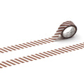 A roll of brown and white striped tape is lying on a white surface, with two parallel strips of tape visible.