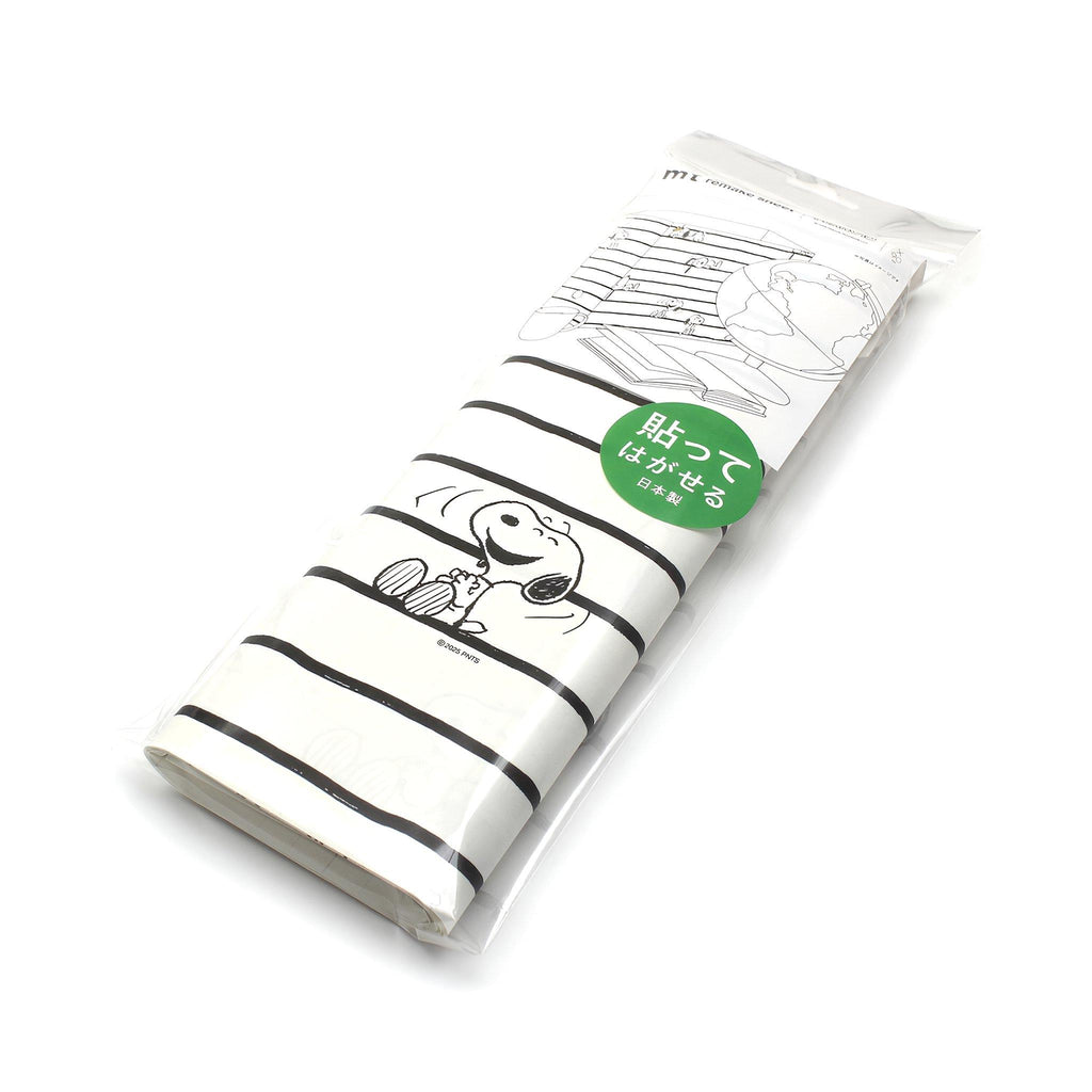 A package of Peanuts-themed paper towels with a cartoon image of Snoopy, a well-known character from the Peanuts comic strip.