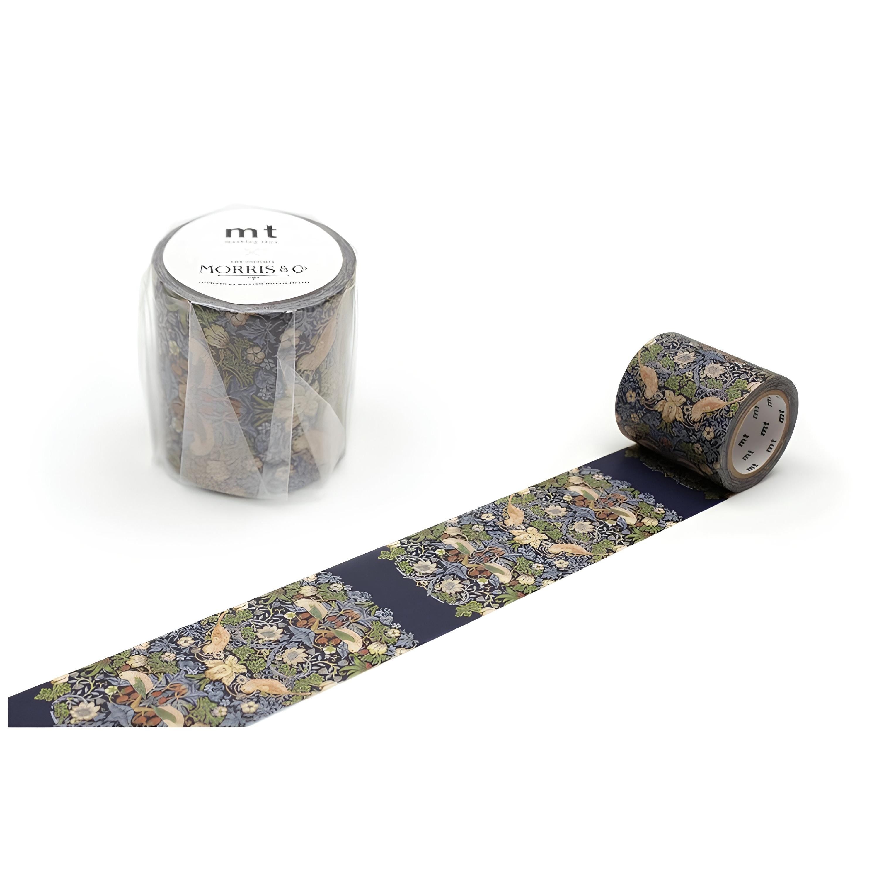 a roll of patterned tape and a clear plastic container with the brand name "mt" printed on it.
