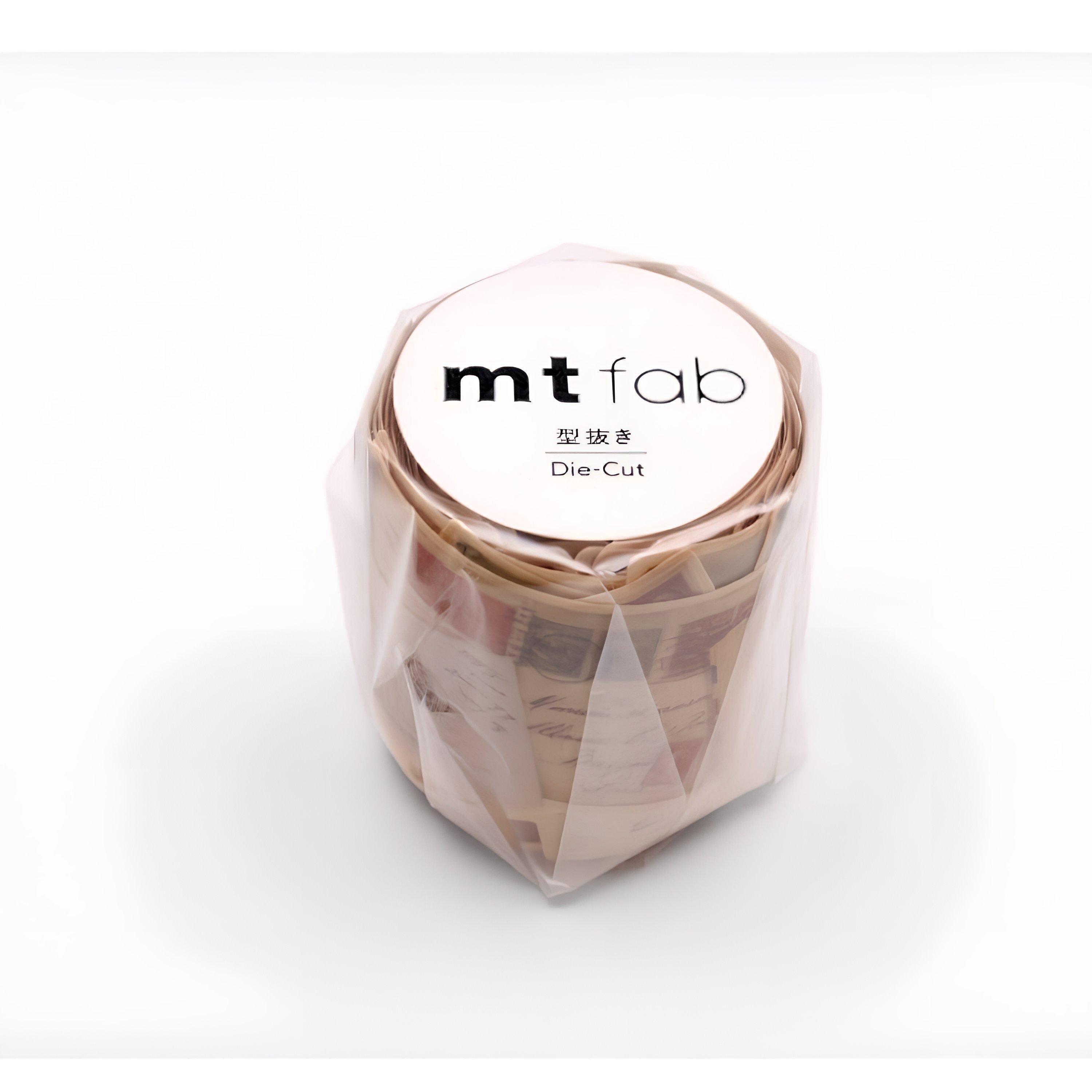 A plastic container with a white label that says "mt fab Die-cut" in black text.