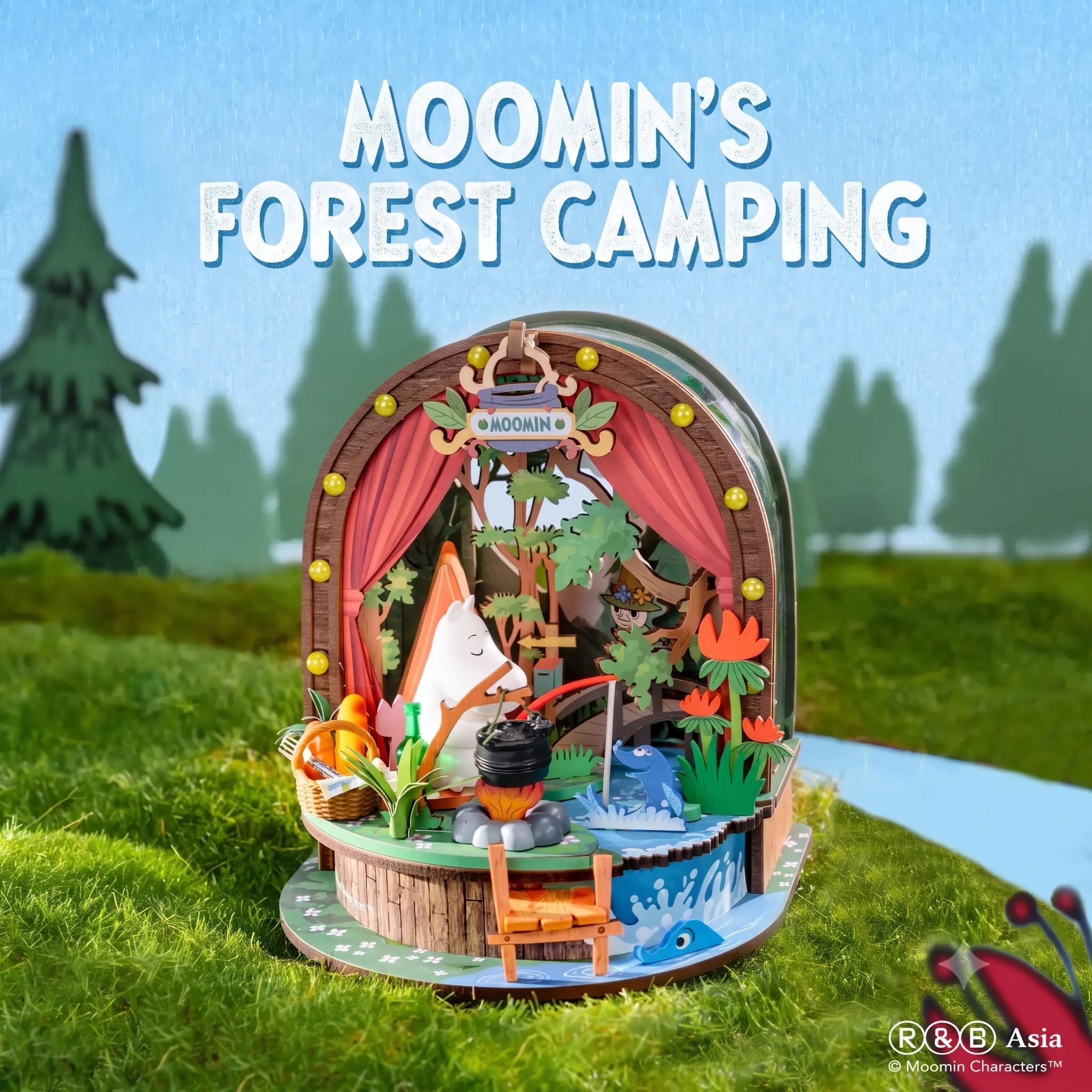 The image is a collage featuring a miniature forest scene with various elements such as a tree, a river, and a small cabin. The text "Moomin's Forest Camping" is prominently displayed above the scene, indicating the theme or subject of the image.