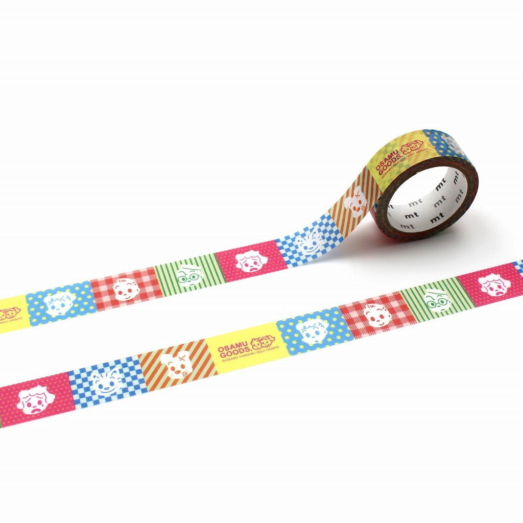 a roll of colorful tape with a pattern of cartoon animal faces on it.