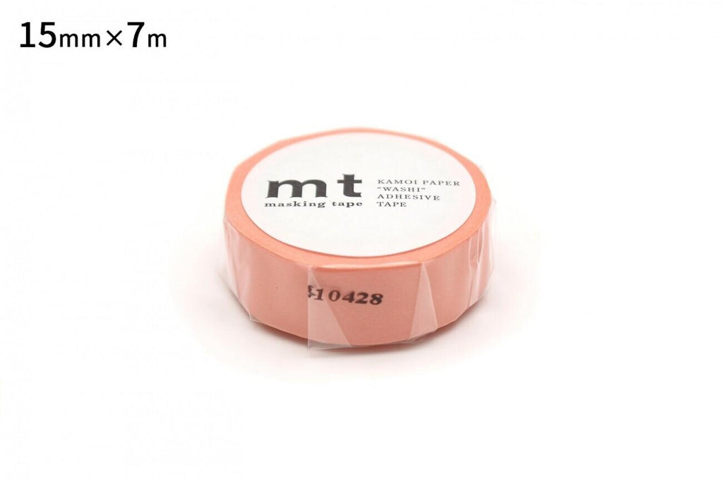 A pink masking tape roll with the text "mT KAMPI PAPER 'WASH' MASKING TAPE" printed on it.
