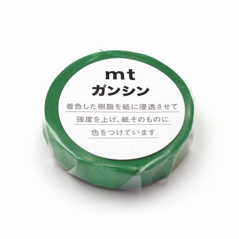 A green circular object with white text on it, which appears to be a product label or packaging.