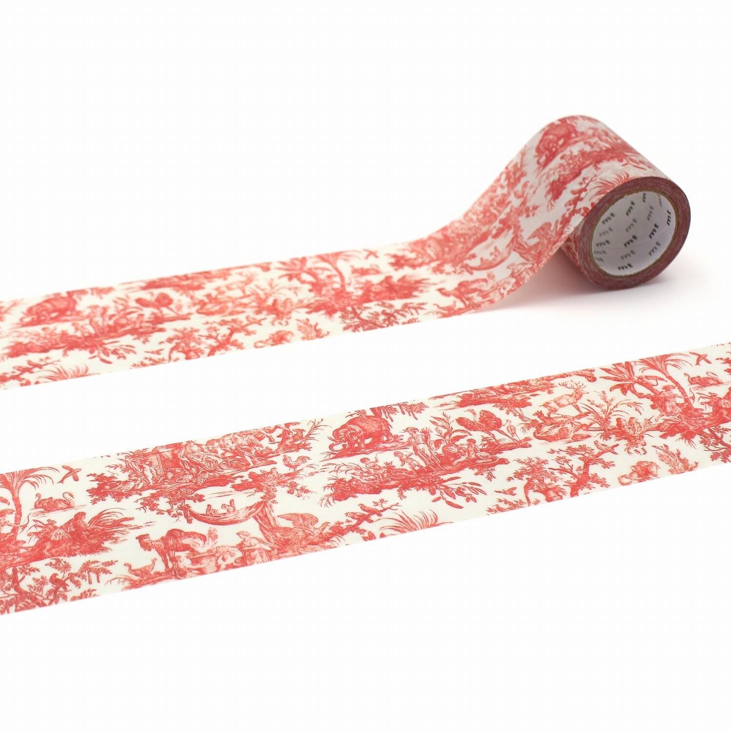 a roll of red and white patterned tape with a floral design, lying on a white surface.