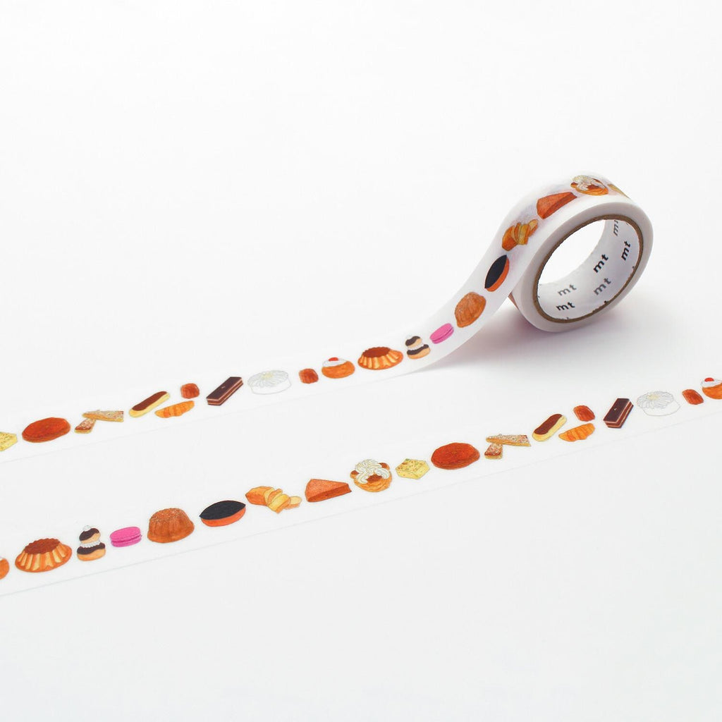 A roll of decorative tape with various food items printed on it, including pastries, fruits, and other culinary items.