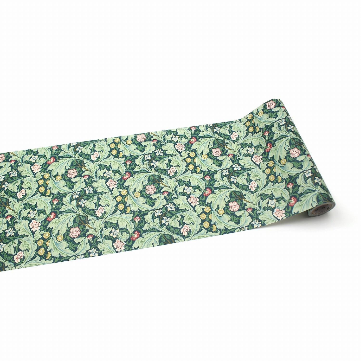a roll of paper with a repeating floral pattern in shades of green and pink.
