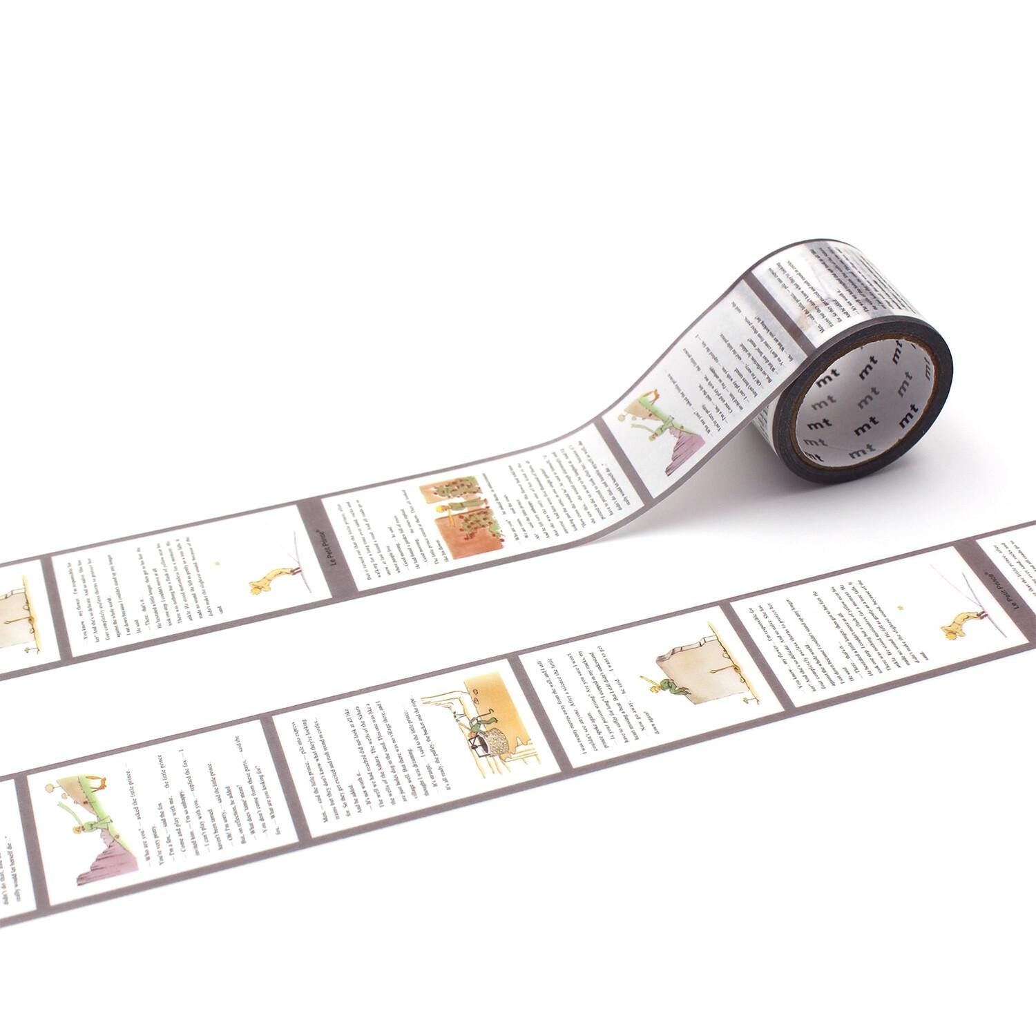 a roll of paper tape with multiple pages of text printed on it, lying on a white surface.