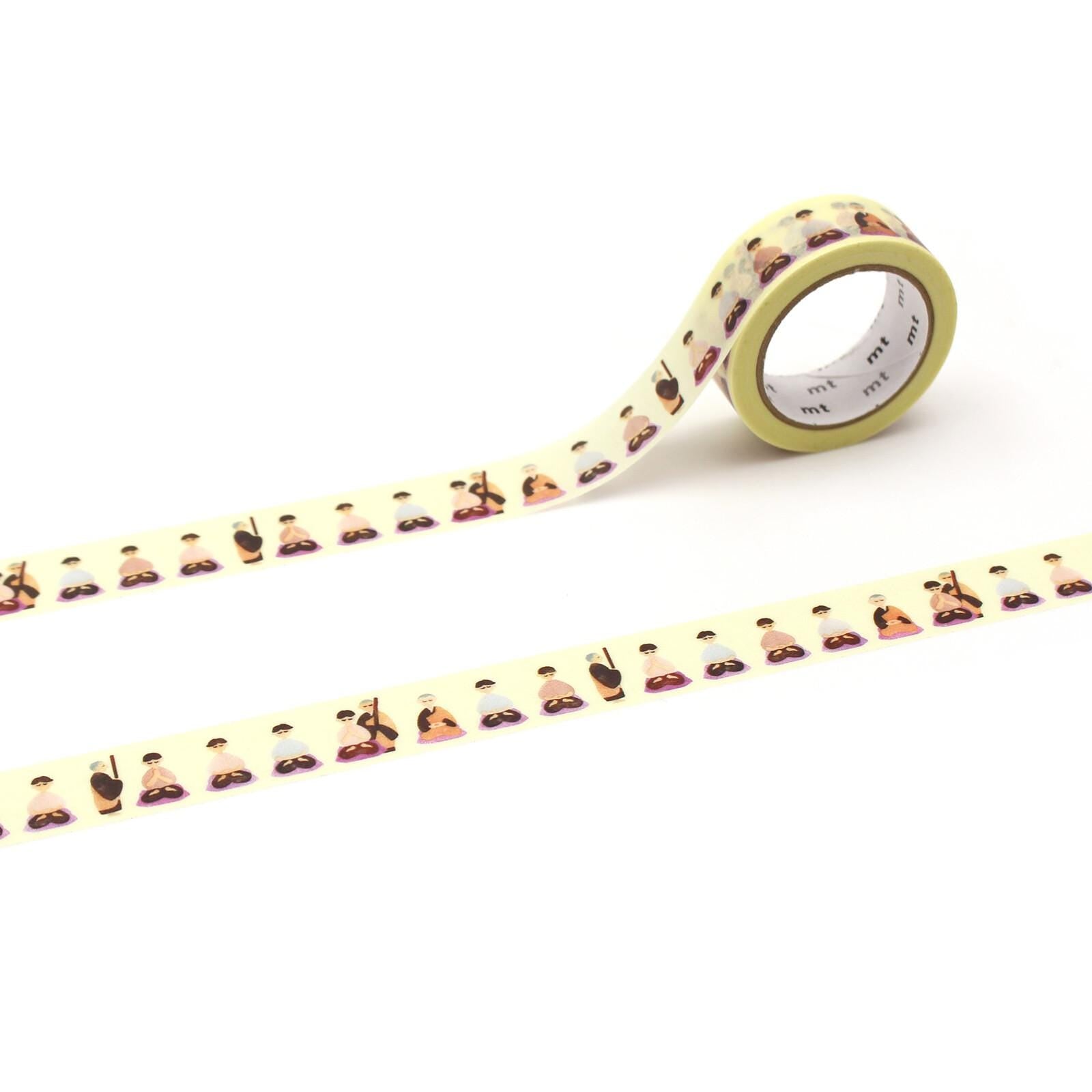 a roll of yellow and white patterned tape with a repeating design of people in various poses.