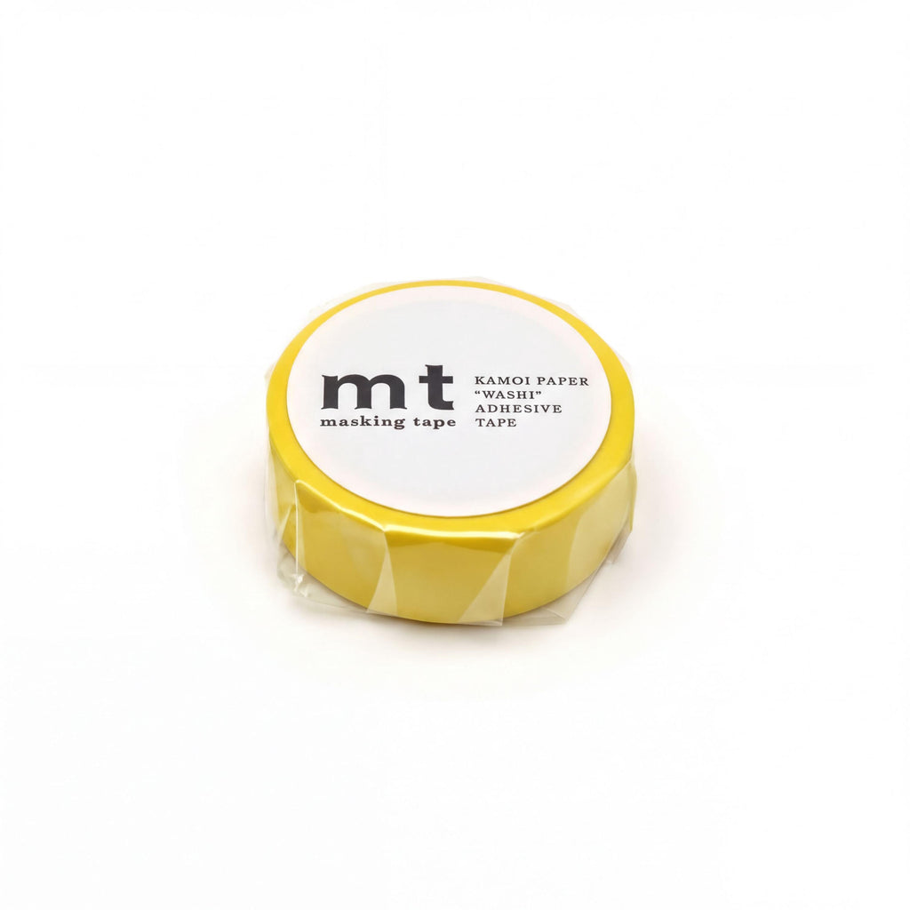 A yellow masking tape roll with a white label that reads "KAMOI PAPER MASKI ADHESIVE TAPE".