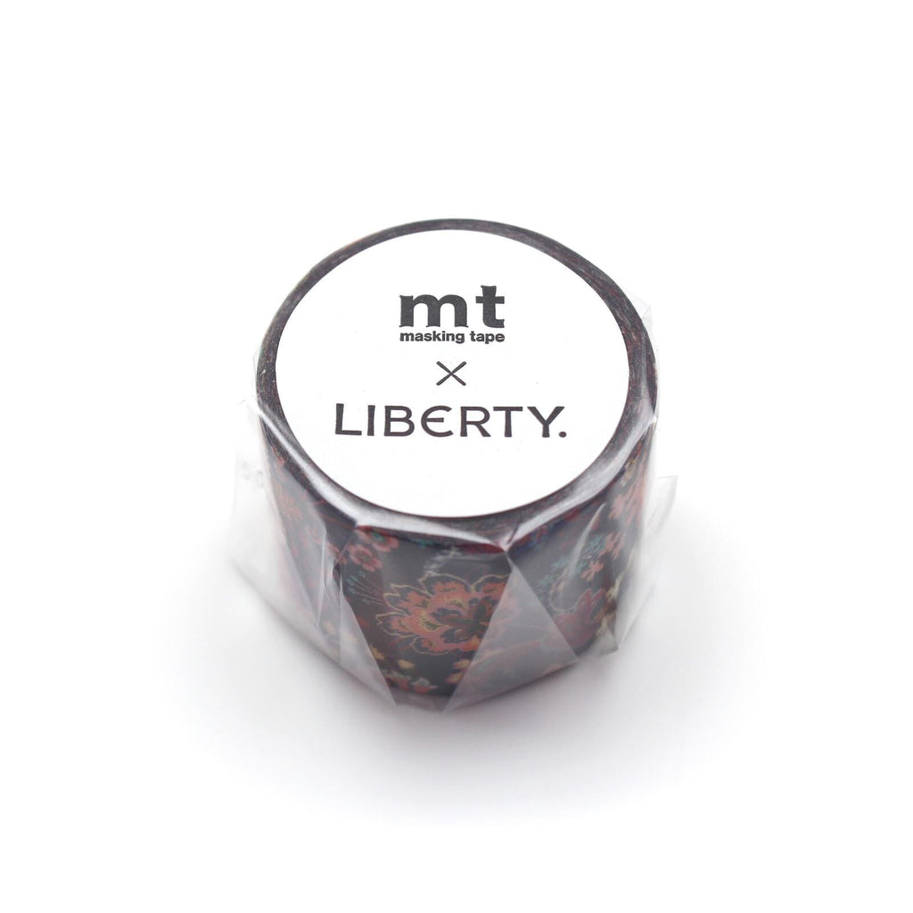 A cylindrical object with a floral pattern, wrapped in plastic and labeled with the text "mt masking tape LIBERTY."