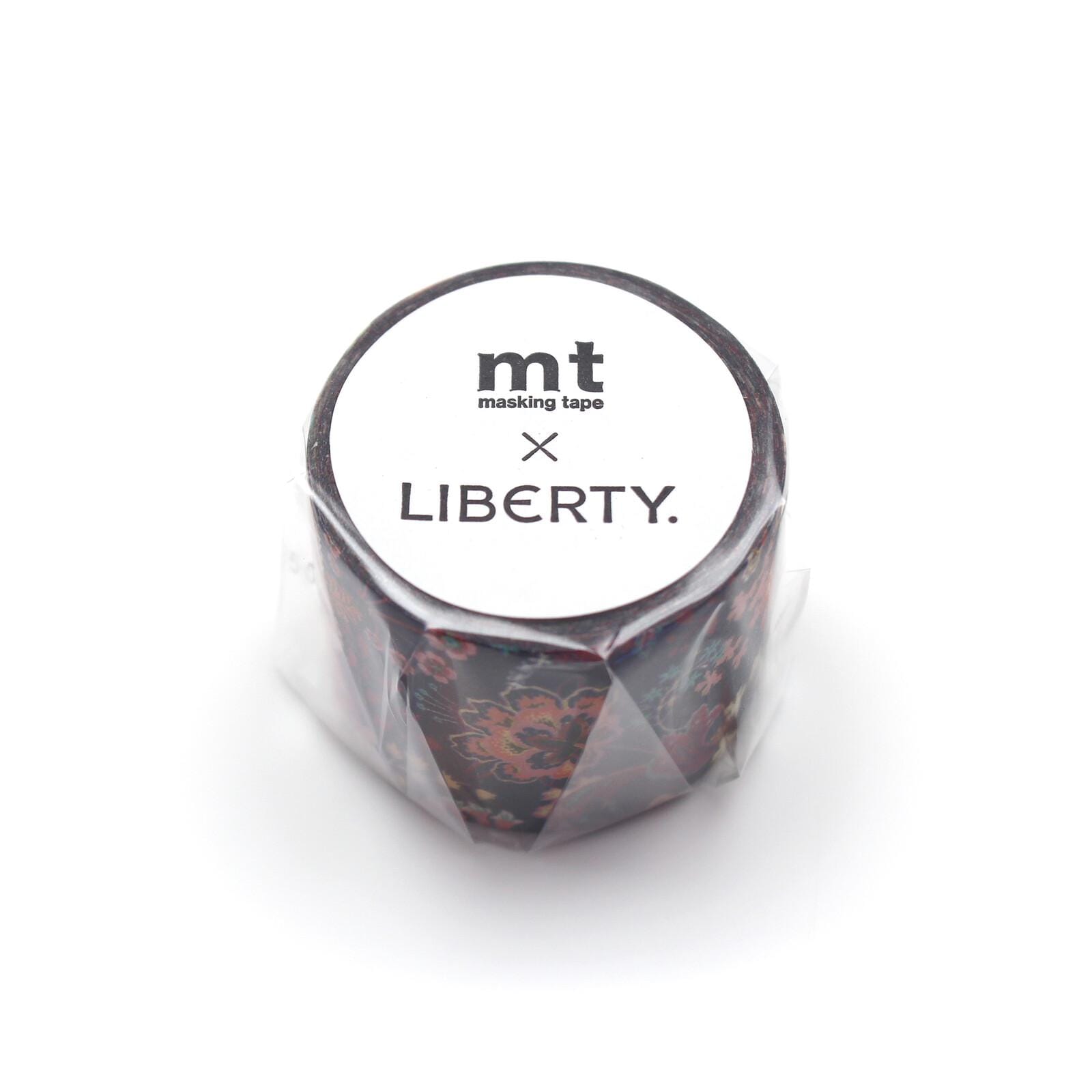 A cylindrical object with a floral pattern, wrapped in plastic and labeled with the text "mt masking tape LIBERTY."