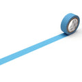 A roll of blue tape with a white pattern on it is lying on a white surface, with a blue line extending from the tape.