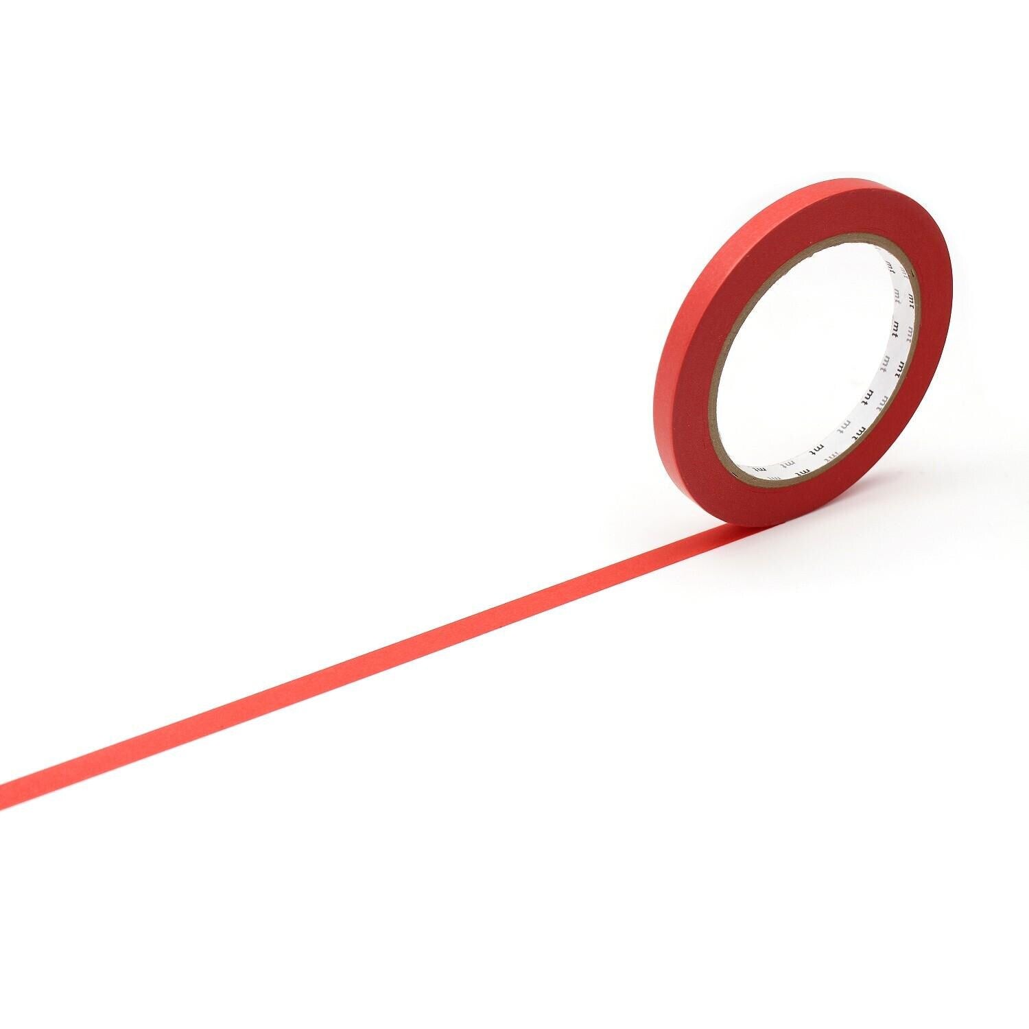 A red roll of tape is lying on its side on a white background, with a long red line extending from the tape.