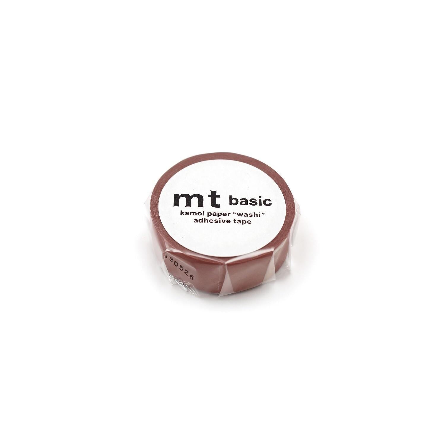 A roll of kamol paper adhesive tape with the text "mt basic" printed on it.