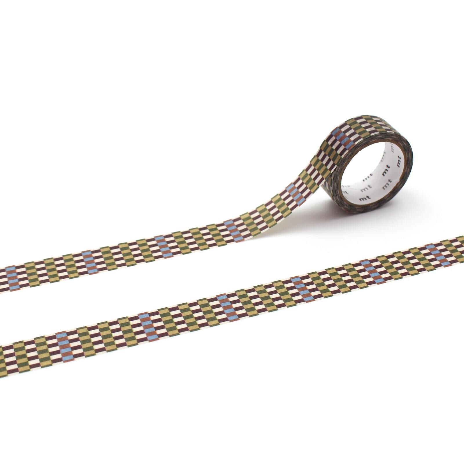 a roll of patterned tape with a checkered design, lying on a white surface.