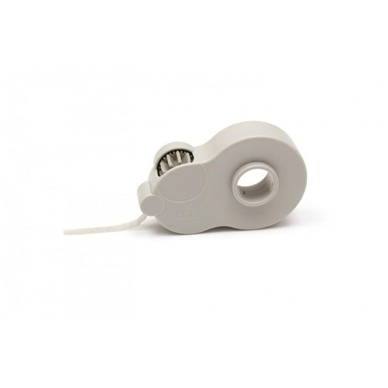 A white roll of tape with a spout and a hole in the center, sitting on a white surface.
