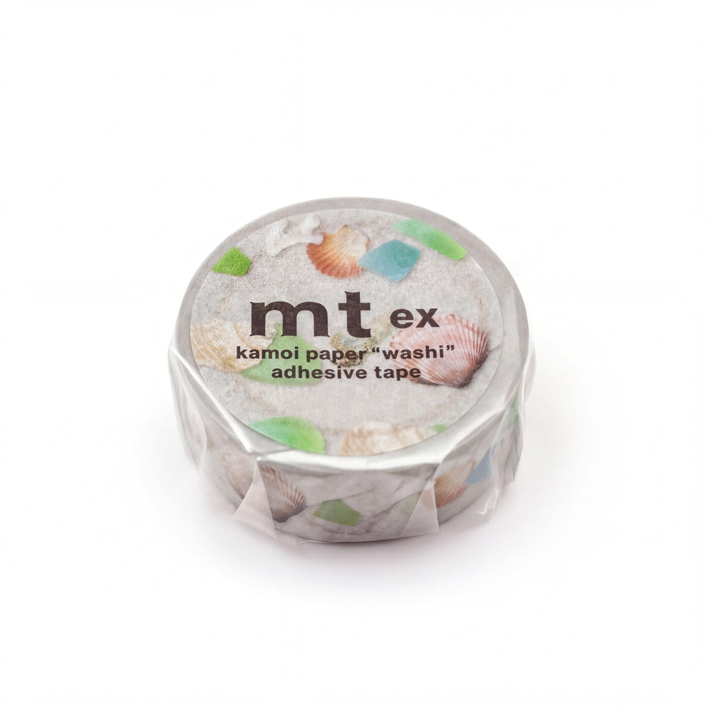 A round, silver-colored container with a label that reads "mt ex kamori paper washi adhesive tape".